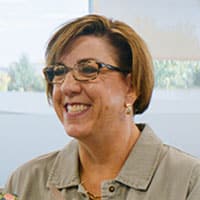 Woman Smiling and Wearing Glasses