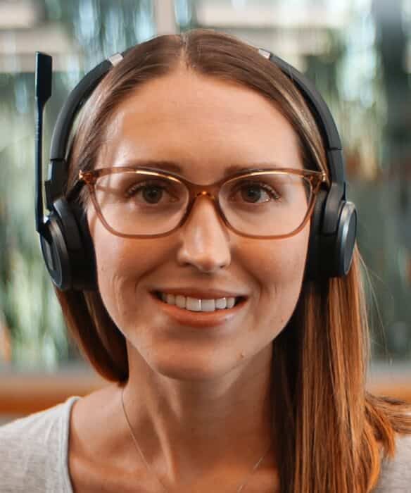 Woman wearing a headset smiling into camera